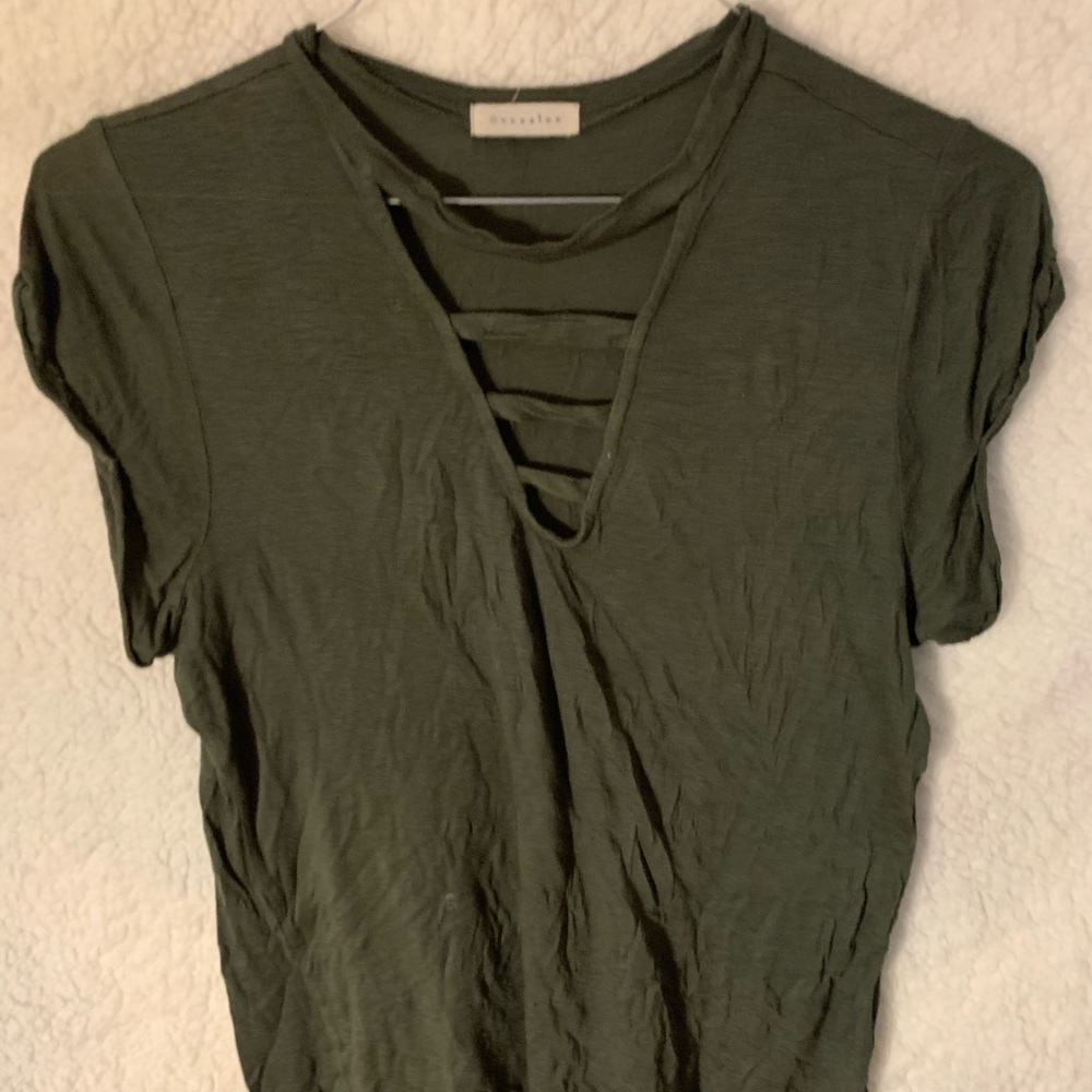 Green top with cutouts on chest